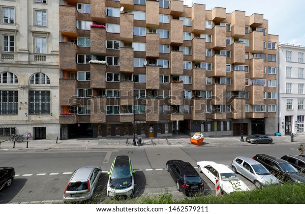 Warsaw, Poland - July 22, 2019: There is a\
multi-family building with many, in an interesting way planned\
balconies, which are an integral part of the\
facade.