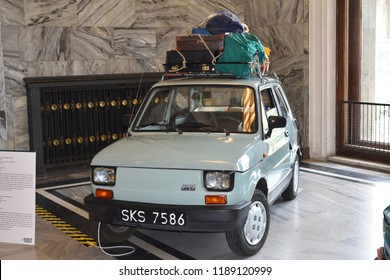 Warsaw, Poland - July 31, 2018: Vintage car Polski Fiat 126p (year 1973) with suitcases on the roof. Technical museum in the Palace of Culture and Science.