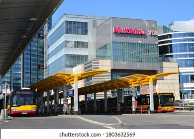 Warsaw, Poland - July 31 2020: Warsaw Red And Yellow Solaris Public Buses In The Depot. Bus Stop Next To Central Railway Station (Warszawa Centralna) And Golden 
Terraces (Zlote Tarasy) Shopping Mall