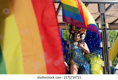 WARSAW, POLAND - JUNE 25: Gay Pride Parade, Drag Queen Watching Her Phone At Equality March Or Lgbt Gay Parade At Warsaw, Poland On June 24, 2022