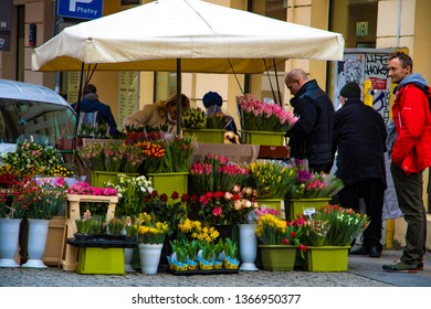 Warsaw, Poland, March 10, 2019: Men Buy Flowers In A Flower Shop.