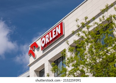 Warsaw, Poland - May, 2022: View on PKN Orlen - Polish oil company logotype on the top of building