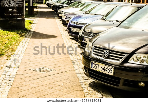 WARSAW, POLAND\
- MAY 27, 2017:  luxury Cars For Sale Stock Lot Row. Car Dealer\
Inventory. Cars For Sale Stock Lot Row. Car Dealer Inventory.\
sunset sun rays light. sun\
beam