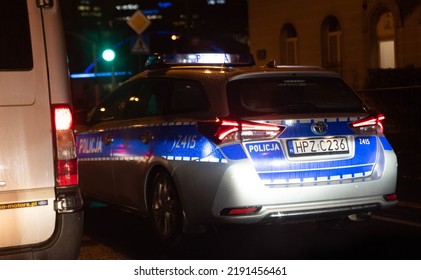 Warsaw, Poland - November 24, 2021: Police Car With Light Signals Turned On At Night. A Night Traffic Incident.