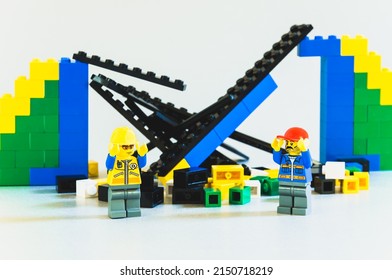 Warsaw, Poland - October 18th 2019: Lego blocks. Workers team builds a bridge. Failure concept, bad job. Accident at the construction site. Collapse of the building structure.
