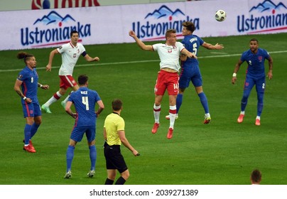 WARSAW, POLAND - September 08, 2021: World Cup 2022 Qatar Qualification Gropu Stage Poland - England, Adam Buksa (Poland) John Stones (England) 