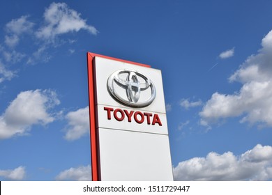 Warsaw, Poland - September 14, 2019: Toyota sign at Toyota Okecie salon building, blue sky in background