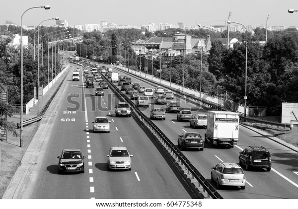 WARSAW, POLAND - SEPTEMBER 8,\
2010: Heavy street traffic in Warsaw, Poland. European road E30\
(national road 2) is one of most important traffic arteries in\
Warsaw.
