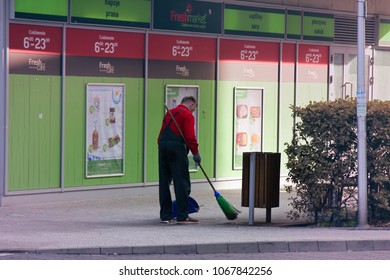 Warsaw, Poland - September 8, 2017: Morning Job Is Janitor (sanitation Worker) At Supermarket, Sweep Streets