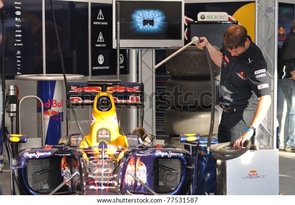 WARSAW -\
SEPTEMBER 04: Red Bull Racing mechanics, working on Mark Webber\'s\
car, after his demonstration ride, during the \