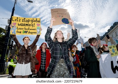 Warsaw, September 2022: Young Activists Marching On Streets With Banners At Youth Strike For Climate In Protest Of Climate Change Policy