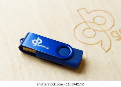 WARSAW/POLAND - JULY 14, 2018: View On Wooden GetBack Logotype And Pendrive - Debt Collection Company