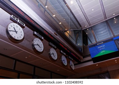 WARSAW/POLAND - March 27, 2018:  View On Clocks In Trading Room Of Warsaw Stock Exchange (WSE, GPW) And Digital Stock Quote Of WIG20 Index