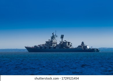 Warship. Missile cruiser. Military ship close-up. Fleet. Navy. Protection of the state's Maritime borders. Ship against the blue sky. Combat duty on the water.
