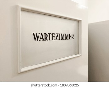 Wartezimmer Is German For Waiting Room - Sign On Door In GP Or Doctor's Practice