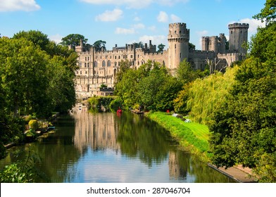 Warwick castle from outside. It is a medieval castle built in 11th century and a major touristic attraction in UK nowadays. Sunny day - Shutterstock ID 287046704