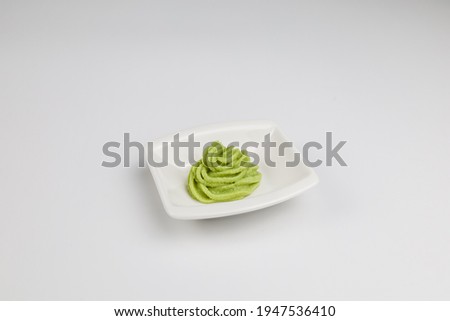 Wasabi is a Japanese seasoning. The appearance is creamy, yellowish green, with a pungent smell. The taste is spicy and tingles from the root. Or the large underground trunk of Wasabia (Wasabia japoni