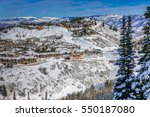 The Wasatch Mountain Range viewed from the top of the Deer Valley Ski Resort, near Park City, Utah, a short drive from Salt Lake City on a partly cloudy winter day in December.