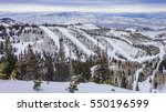The Wasatch Mountain Range viewed from the top of the Park City  Ski Resort, Utah, close to The Canyons and Deer Valley, a short drive from Salt Lake City on a partly cloudy winter day in December.