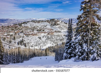 The Wasatch Mountain Range viewed from the top of the Deer Valley Ski Resort, near Park City, Utah, a short drive from Salt Lake City on a partly cloudy winter day in December.
