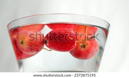 Wash the apples in a glass bowl filled with clean water