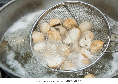 wash and cut mushrooms, blanching in boiling water for 30 seconds, drain, leave them cool and put into bottles, can store in refrigerator for 1-2 weeks. Kitchen tips - Powered by Shutterstock