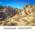 A wash cuts through the biotite monzogranite rock formations at Alabama Hills, California