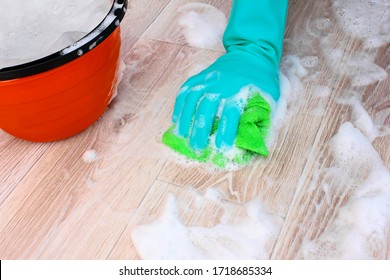 To Wash The Floor, Linoleum, Parquet With A Rag. Hand In Rubber Gloves, A Bucket Of Soapy Water For Mopping And Damp Cleaning.