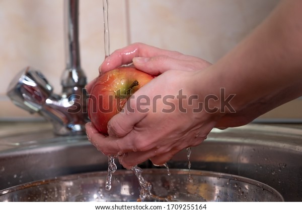 Wash fruits and\
vegetables in a sink
