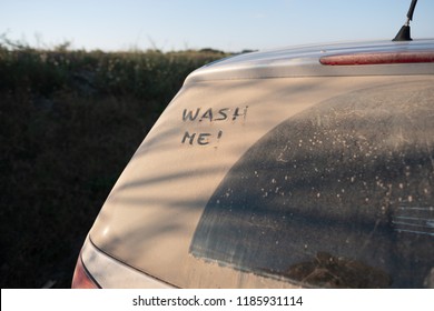 Wash Me Message On Dirty Car Window