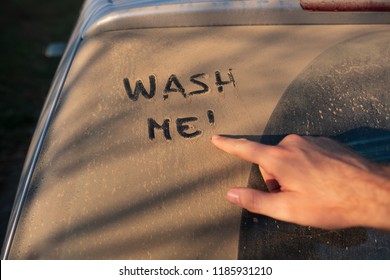 Wash Me Message On Dirty Car Window