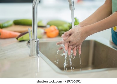 Wash your hands before cooking. - Shutterstock ID 719766691