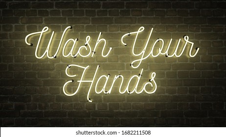 Wash Your Hands bright neon sign in a brick background, reminding people to wash their hands after using the bathroom so you prevent getting Coronavirus or Covid-19