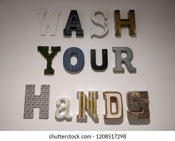 Wash Your Hands Sign On A Wall.