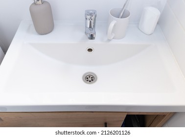 Washbasin with faucet and beautiful jar for liquid soap