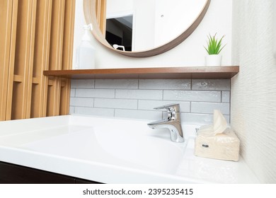 A washbasin in a newly built house. - Shutterstock ID 2395235415
