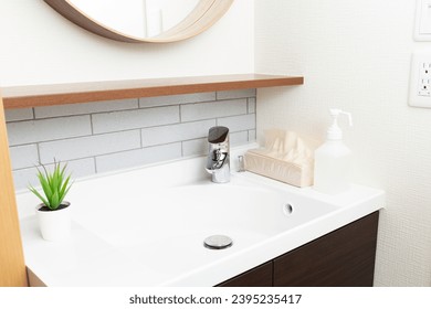 A washbasin in a newly built house. - Shutterstock ID 2395235417