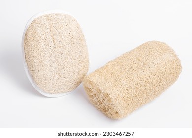 Washcloth for shower on white background. Natural luffa. Two sponges