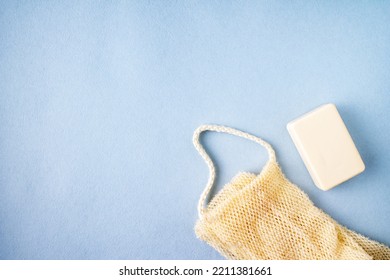 Washcloth And Soap On Blue Background, Copy Space