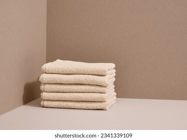 Washed clean fresh towels are on the table. Copy space for text. - Shutterstock ID 2341339109