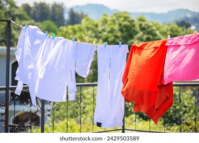 The washed clothes are hung up and drying in the wind.