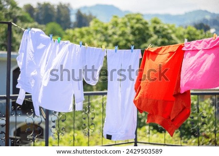 The washed clothes are hung up and drying in the wind.