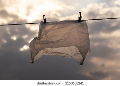 Washed Plastic Bag Hangs On A Rope. Reuse Concept.