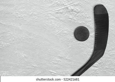 Washer And Black Stick On The Ice Hockey Rink. Concept, Background