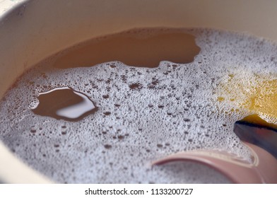 Washing Up Bowl With Suds In A Sink