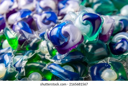 Washing capsules. Capsules with liquid powder for washing things in the washing machine. Capsules background. - Shutterstock ID 2165681567