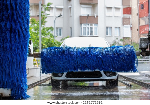 Washing the car in an automatic washing machine.\
Brushed Car Washing\
Machine
