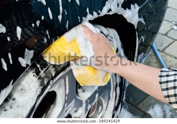 washing a car by hand
