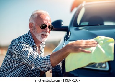 Washing Car. Senior Man Polishing His Car With Microfiber Cloth.