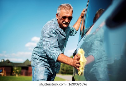 Washing Car. Senior Man Polishing His Car With Microfiber Cloth